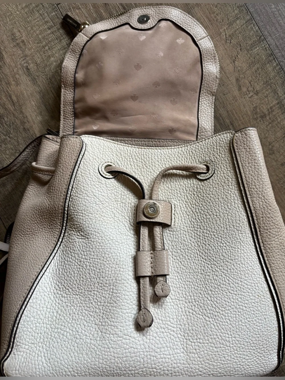 Kate Spade women’s Leila Medium Flap Backpack beige cream pebbled leather purse